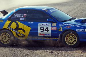 Piotr Fetela / Ray Vambuts in their Subaru Impreza STi on SS1 (Green Acres I)