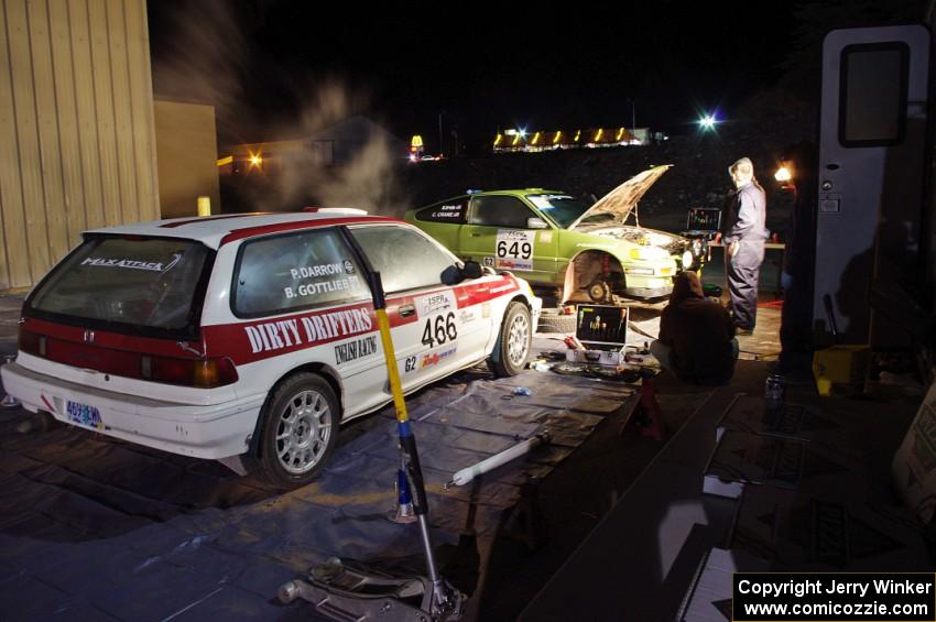 The Brian Gottlieb / Pat Darrow Toyota FX-16 and Cody Crane / Billy Irvin Honda CRX get final prep the night before the rally.