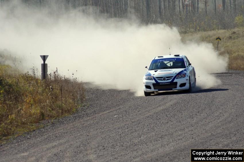 Eric Burmeister / Dave Shindle in their Mazda MAZDASPEED 3 on SS1 (Green Acres I)