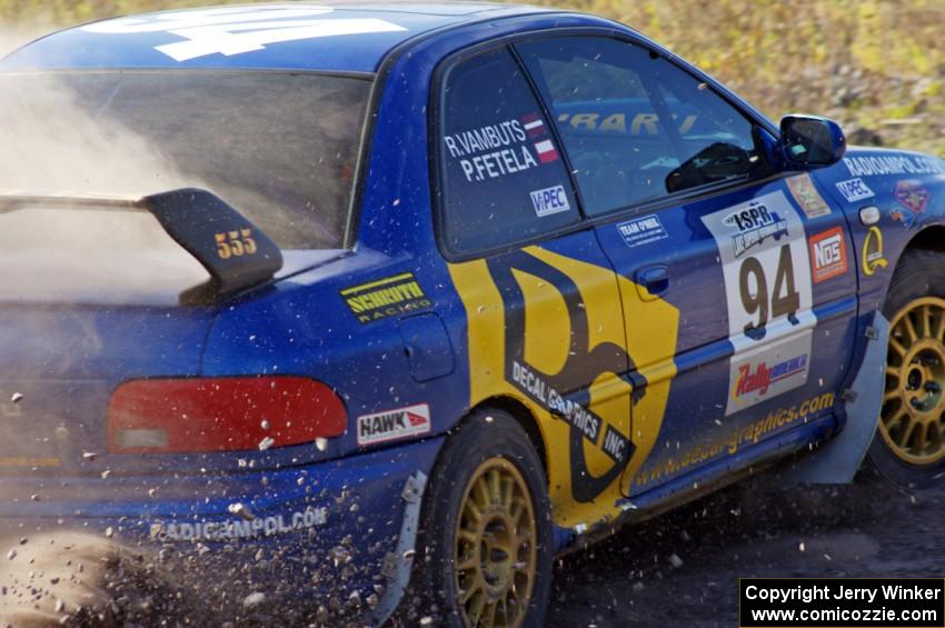 Piotr Fetela / Ray Vambuts in their Subaru Impreza STi on SS1 (Green Acres I)