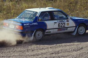 Scott Sanford / Joel Sanford in their BMW 325i on SS1 (Green Acres I)