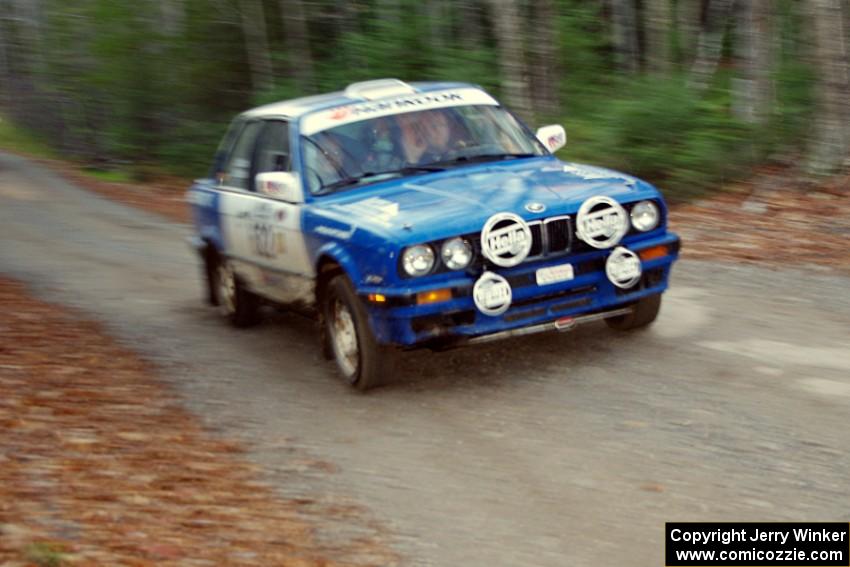 Scott Sanford / Joel Sanford in their BMW 325i on SS5 (Herman II) after getting pulled back onto the road.