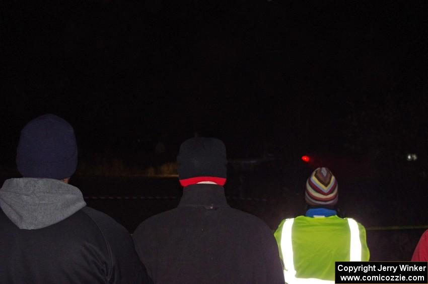 Spectators and a marshal watch as the Dodge SRT-4 of Doug Shepherd / Karen Wagner passes by.