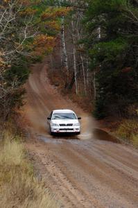 Jan Zedril / Jody Zedril in their Mitsubishi Lancer ES near the finish of SS10 (Menge Creek 1)