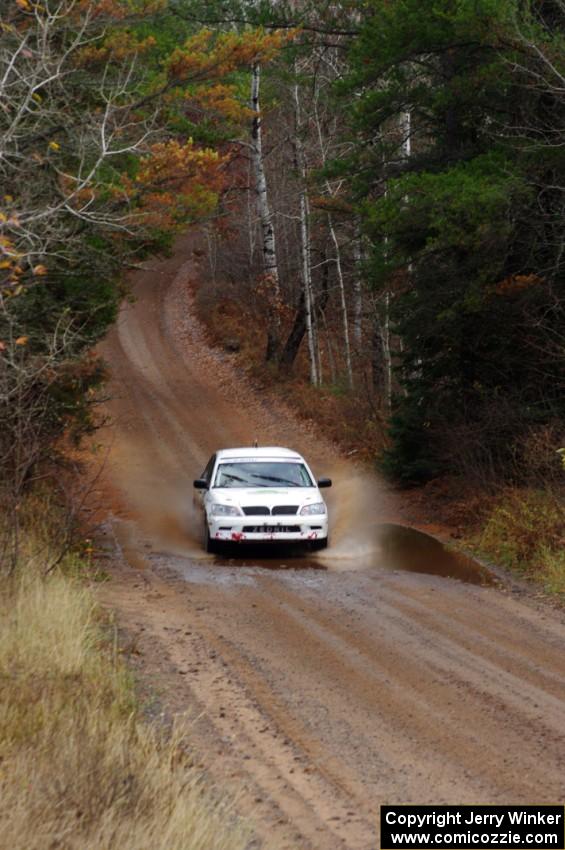 Jan Zedril / Jody Zedril in their Mitsubishi Lancer ES near the finish of SS10 (Menge Creek 1)