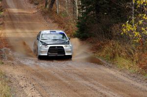 Vio Dobasu / Nathalie Richard in their Mitsubishi Lancer Evo X near the finish of SS10 (Menge Creek 1)