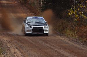 Vio Dobasu / Nathalie Richard in their Mitsubishi Lancer Evo X near the finish of SS10 (Menge Creek 1)