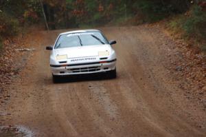 Mychal Summers / Ryan DesLaurier in their Mazda RX-7 on SS10 (Menge Creek 1)