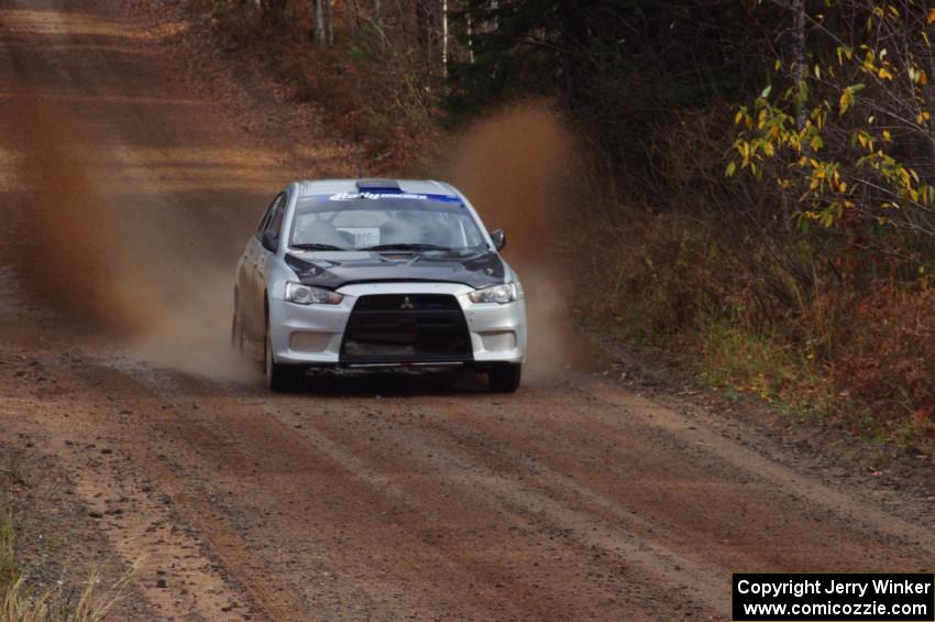 Vio Dobasu / Nathalie Richard in their Mitsubishi Lancer Evo X near the finish of SS10 (Menge Creek 1)