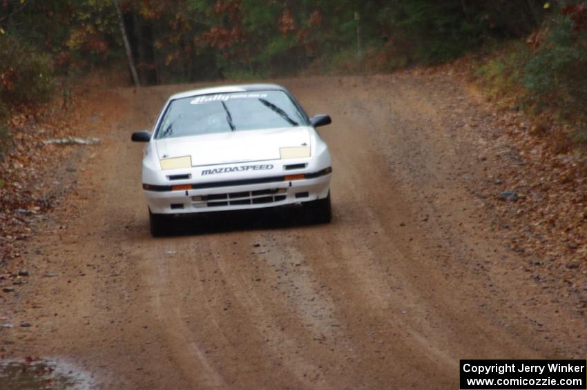 Mychal Summers / Ryan DesLaurier in their Mazda RX-7 on SS10 (Menge Creek 1)