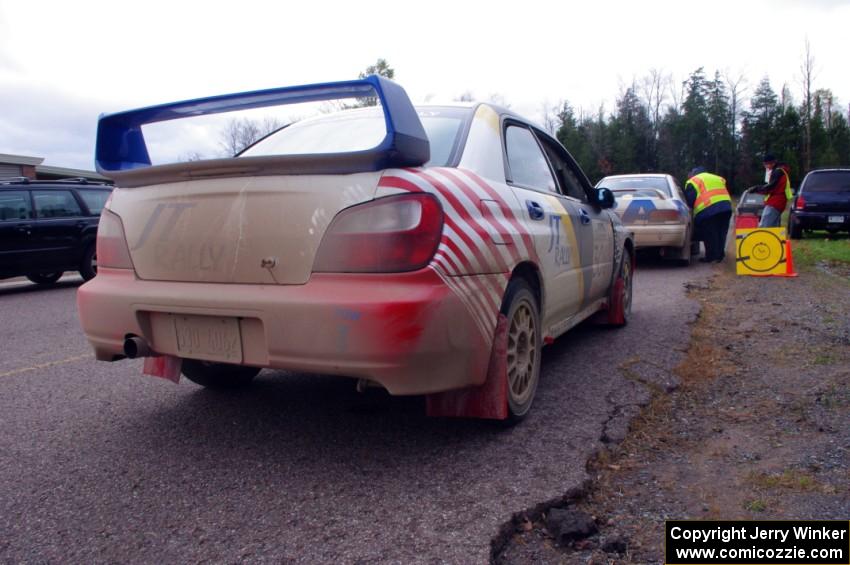 Janusz Topor / Michal Kaminski in their Subaru WRX STi about to head back out after L'Anse service