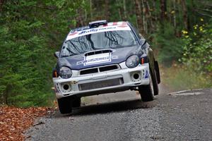 Adam Yeoman / Jordan Schulze in their Subaru Impreza catch air on SS13 (Herman 1)