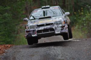 Mason Moyle / Gary Barton in their Subaru Impreza 2.5RS catch air on SS13 (Herman 1)