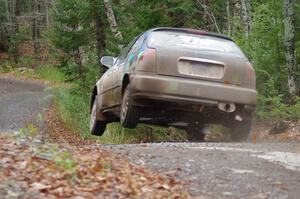 Billy Mann / Mary Warren in their Honda Civic catch air on SS13 (Herman 1)