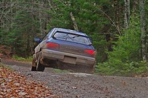 Piotr Fetela / Ray Vambuts in their Subaru Impreza STi catch air on SS13 (Herman 1)