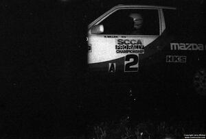 Rod Millen / Harry Ward in their Gr. A Mazda 323GTX through the flying finish of the final stage.