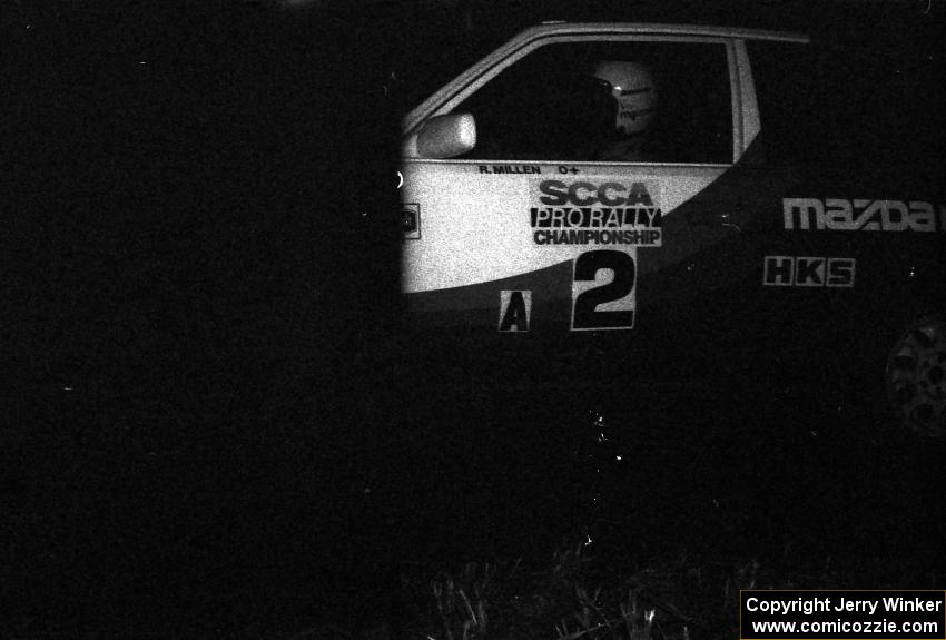 Rod Millen / Harry Ward in their Gr. A Mazda 323GTX through the flying finish of the final stage.