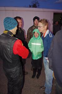 Jan Zedril, Silas Himes and Matt Himes chat at the finish of the rally in L'Anse, MI