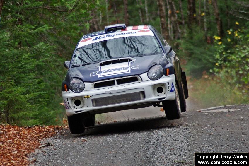 Adam Yeoman / Jordan Schulze in their Subaru Impreza catch air on SS13 (Herman 1)