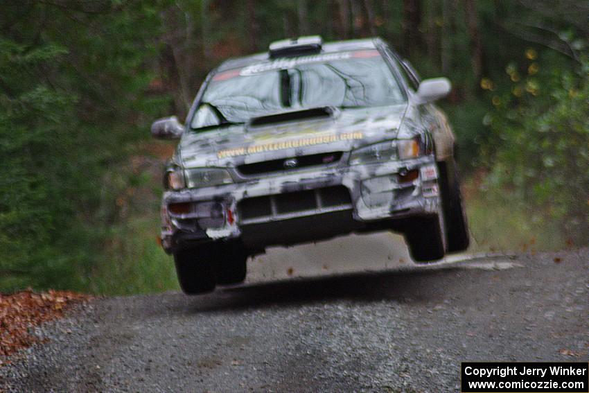 Mason Moyle / Gary Barton in their Subaru Impreza 2.5RS catch air on SS13 (Herman 1)