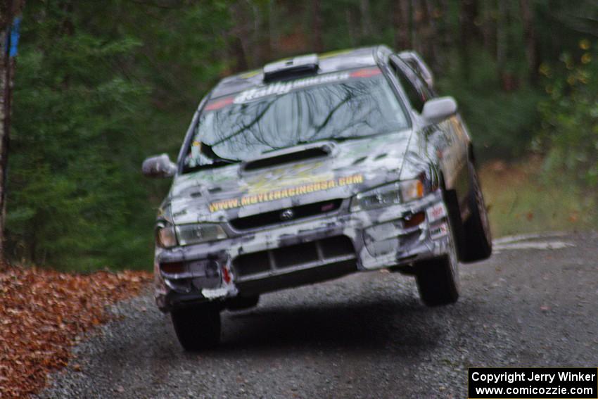 Mason Moyle / Gary Barton in their Subaru Impreza 2.5RS catch air on SS13 (Herman 1)