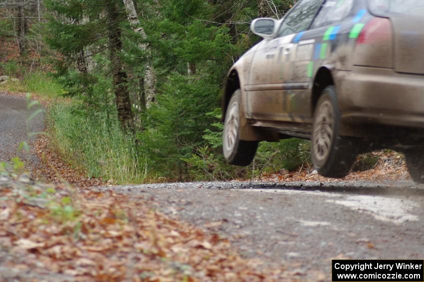 Billy Mann / Mary Warren in their Honda Civic catch air on SS13 (Herman 1)