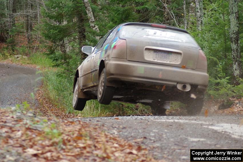 Billy Mann / Mary Warren in their Honda Civic catch air on SS13 (Herman 1)