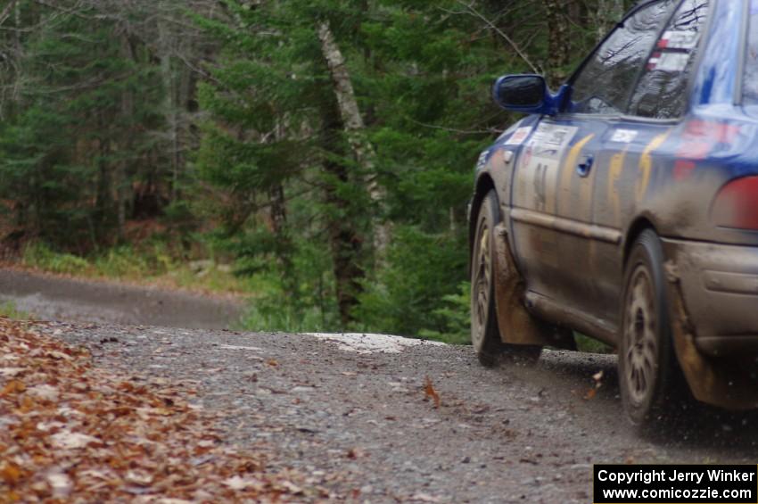 Piotr Fetela / Ray Vambuts in their Subaru Impreza STi catch air on SS13 (Herman 1)