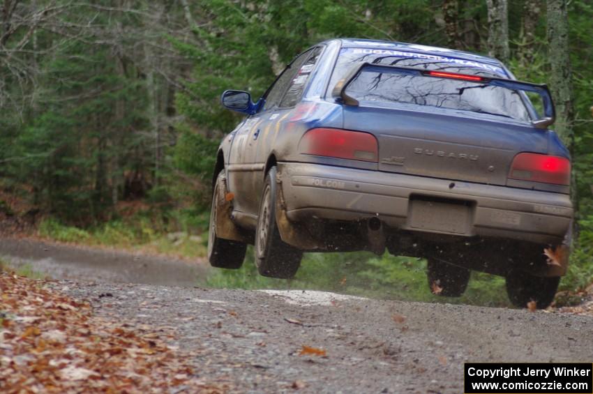 Piotr Fetela / Ray Vambuts in their Subaru Impreza STi catch air on SS13 (Herman 1)