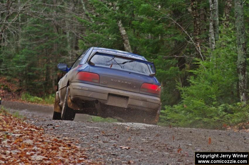 Piotr Fetela / Ray Vambuts in their Subaru Impreza STi catch air on SS13 (Herman 1)