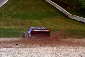 Steve Kracht's Dodge Avenger takes a wild ride off into the gravel at turn 5.