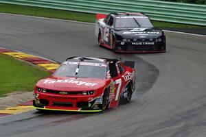 Regan Smith's Chevy Camaro and Sam Hornish, Jr.'s Ford Mustang