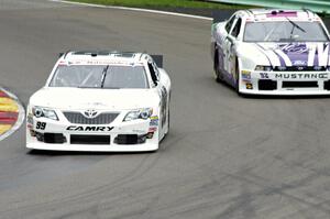 Alex Bowman's Toyota Camry passes Dexter Stacey's Ford Mustang