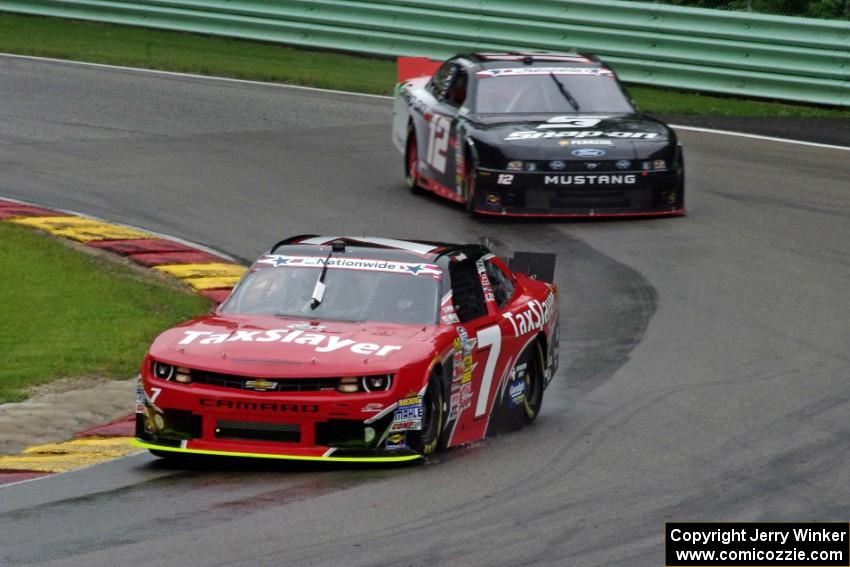 Regan Smith's Chevy Camaro and Sam Hornish, Jr.'s Ford Mustang