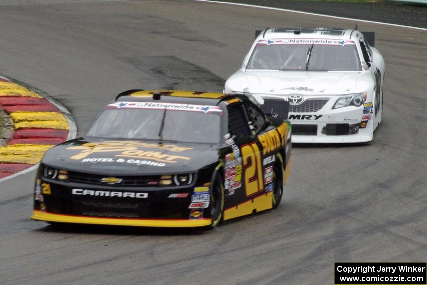 Brendan Gaughan's Chevy Camaro and Alex Bowman's Toyota Camry