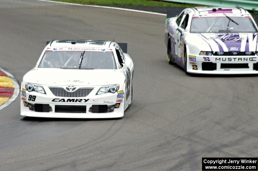 Alex Bowman's Toyota Camry passes Dexter Stacey's Ford Mustang