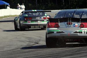 Scott Ferguson's Pontiac GTO.R follows Gregg Rodgers's Chevy Camaro out of turn 12