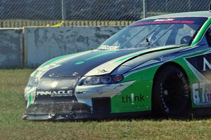 Scott Ferguson's Pontiac GTO.R drives straight off at turn 12 under braking.