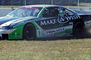 Scott Ferguson's Pontiac GTO.R drives straight off at turn 12 under braking.