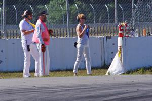 Corner captain Bob Brist and two others at turn 12