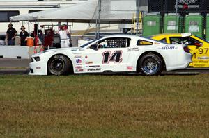 Joe Ebben's Ford Mustang spins backward out of turn 12