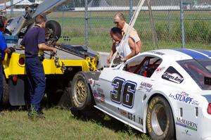 Cliff Ebben's Ford Mustang comes in on the hook after wrecking the front