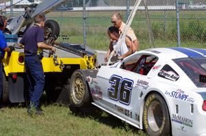 Cliff Ebben's Ford Mustang comes in on the hook after wrecking the front