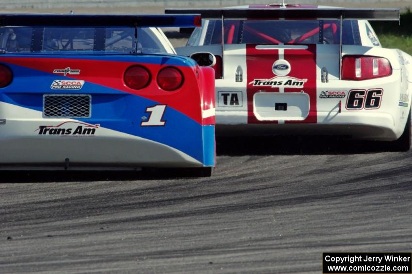 Denny Lamers's Ford Mustang and Simon Gregg's Chevy Corvette out of turn 12