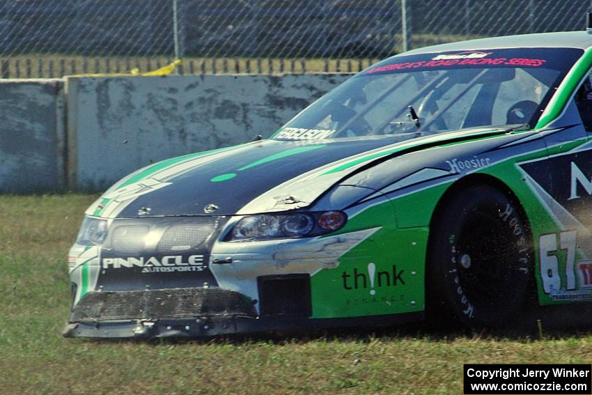 Scott Ferguson's Pontiac GTO.R drives straight off at turn 12 under braking.