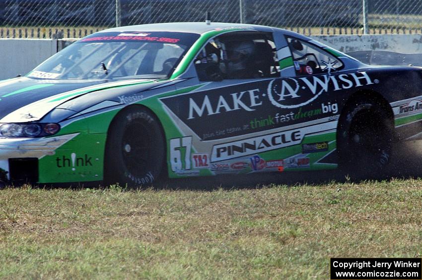 Scott Ferguson's Pontiac GTO.R drives straight off at turn 12 under braking.