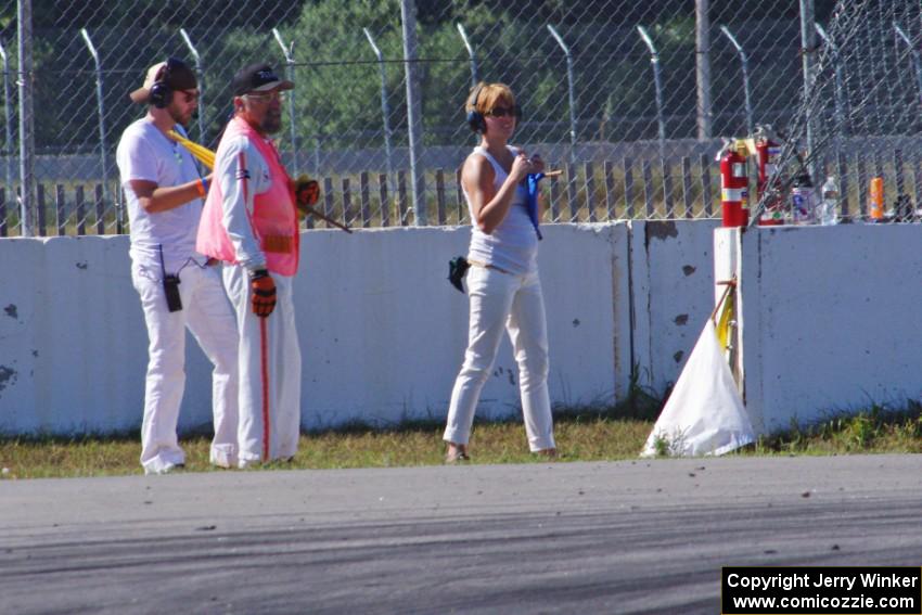 Corner captain Bob Brist and two others at turn 12