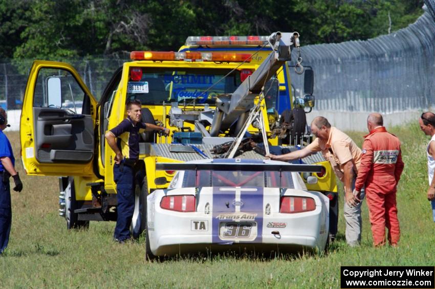 Cliff Ebben's Ford Mustang gets towed back after wrecking the front
