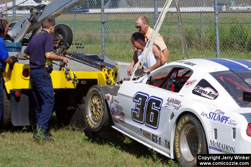 Cliff Ebben's Ford Mustang comes in on the hook after wrecking the front