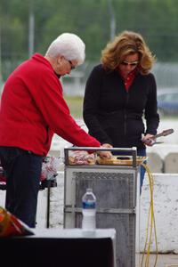 Amy Ruman and her mother grill before the race